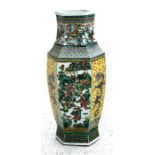 A large Chinese famille verte vase of octagonal form highly decorated with figures dragons and