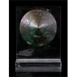 A Warring States or Han Dynasty period bronze buckle of circular conical form, on perspex stand, 6.