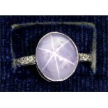 A star sapphire and diamond ring, set with an oval cabouchon pale blue star sapphire, approx. 7.3ct,