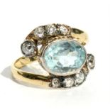 An aquamarine & diamond ring, the central oval aquamarine approximately 1.2ct, flanked by eight