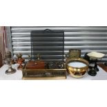 An Indian brass bowl on stand, a pair of 19th century candlesticks, a set of kitchen scales and