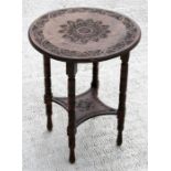 A late 19th century circular walnut occasional table with carved decoration, on ring turned legs,