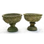 A pair of weathered two-part reconstituted stone garden planters, 53cms (21") wide (2).