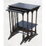 An Edwardian mahogany nest of three tables, with rectangular tops raised on collared cylindrical