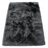 A Bomat Rug Creation handwoven broadloom rug in charcoal grey.
