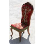 A Victorian walnut chair with woolwork upholstered seat and back, standing on cabriole legs.