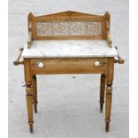 A Victorian tiled back marble topped pine wash stand with original painted decoration, with single