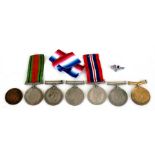 A group of WWII medals including two Defence and four War medals