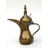 A Turkish/Islamic dallah coffee pot with impressed mark to the body, 29cm (11.5ins) high.