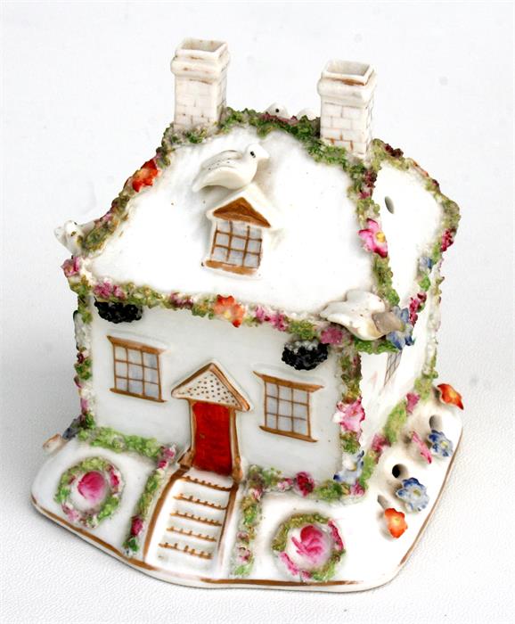 A 19th century Staffordshire porcelain pastille burner in the form of a cottage; together with a - Image 2 of 2