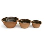 A set of three graduated Studio Pottery bowls, the largest 29.5cms wide; a 19th century two-