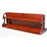 A figured mahogany two-tier wall shelf, 120cm (47ins) wide.