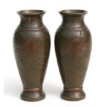 A pair of late 19th century Japanese bronze vases, decorated with dragons, 15cm (6ins) high