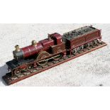 A live steam model of a live steam MR (Midland Railway) no. 2631 locomotive and tender, mounted on a