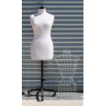 A Kennett & Lindsell tailors mannequin on cast iron stand; together with a wire work dummy (2).