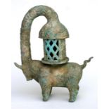 A Chinese archaic style bronze lamp in the form of a buffalo, 25cm (9.75ins) high.