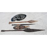 An African pierced and carved paddle spear, 156cm (61.5ins) long, a large carved wooden bowl in