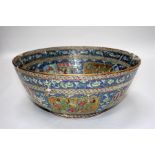 A 19th century famille rose bowl, decorated with figural panels and having a Persian or Arabic