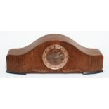 An Art Deco walnut cased Westminster chiming mantle clock, 64cms wide.