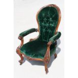 A Victorian walnut button back armchair.