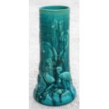 A turquoise glazed Art Nouveau pottery stick stand, decorated in relief with fish and birds, 60cm (