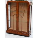 An Art Deco figured walnut glazed display cabinet 87cm wide