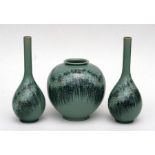 A pair of Korean celadon glazed bottle vases decorated with stylised flowers, together with a