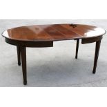 A late 19th century mahogany oval extending dining table with one extra leaf, on square tapering