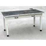 A large industrial type painted metal table with two frieze drawers, on square tapering legs,