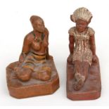A tribal pottery figure in the form of a seated African girl, marked 'The Ceramic Studio' to base,