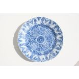 An 18th / 19th century Chinese blue and white plate, highly decorated with flowers, 22cm (8.75