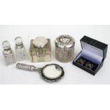 A silver mounted glass inkwell, a silver mounted hair tidy jar, two silver mounted bottles, a plated