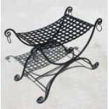 A wrought iron 'X' frame stool, 77cm (30.5ins) wide.