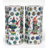 A pair of Chinese sleeve vases of hexagonal form, decorated with flowers, vases and medallions in