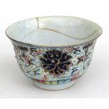 A Chinese doucai porcelain bowl decorated with flowers and medallions, with six character mark to