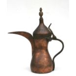 A Turkish / Islamic dallah coffee pot with impressed mark to body, 30cm (12ins) high.