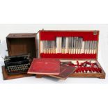A Blick Universal typewriter in original oak case; a canteen of silver plated cutlery; and two