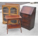 An oak freestanding glazed bookcase, an oak bureau and an Edwardian rectangular topped two-tier