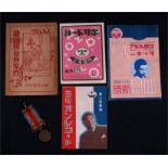 A Japanese WWII China Instant War Dispatch Medal and four Japanese music booklets.