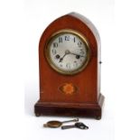 An Edwardian mahogany and inlay mantel clock, the silver dial with Arabic numerals, 30cm (12ins)