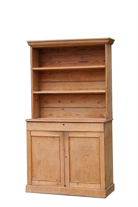 A stripped pine dresser, the two-tier plate rack above a single long drawer with cupboards