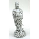 A large Chinese glazed pottery figure depicting a scholar, impressed four character mark to back,