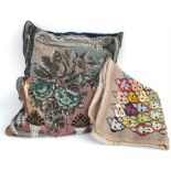 Two Victorian beadwork cushions decorated with flowers, and a woolwork panel (3).