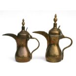 Two Turkish / Islamic dallah coffee pots with impressed mark to bodies, 30cm (12ins) high and