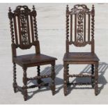 A pair of Victorian oak hall chairs with pierced back splat and barley twist supports.