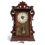 A Victorian Seth Thomas mantle alarm clock, paper dial with Roman numerals striking on a bell and