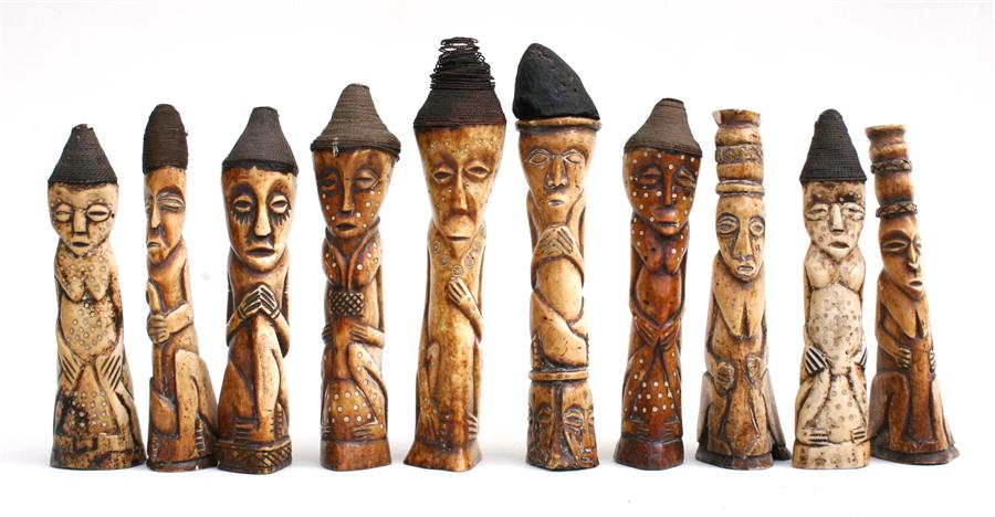 A group of ten African carved bone figures, each approximately 22cm (8.5ins) high (10).