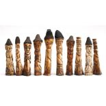 A group of ten African carved bone figures, each approximately 22cm (8.5ins) high (10).