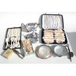 A silver napkin ring, cased silver-plated cutlery and other items (box).