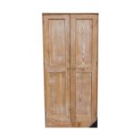 A stripped pine two-door larder cupboard with shelved interior, 92cm (36 ins) wide.